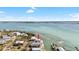 Aerial view of waterfront home surrounded by sparkling water at 9696 Little Gasparilla Isand, Placida, FL 33946