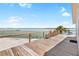 Spacious deck with chairs and beautiful waterfront view for relaxing and enjoying the scenery at 9696 Little Gasparilla Isand, Placida, FL 33946