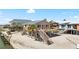 Charming stilt house with a wooden deck and stairs leading to the sandy beach at 9696 Little Gasparilla Isand, Placida, FL 33946