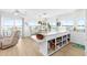 Open kitchen and dining area with large island and water views at 9696 Little Gasparilla Isand, Placida, FL 33946