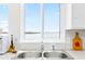 Kitchen sink with a window that has waterfront views at 9696 Little Gasparilla Isand, Placida, FL 33946