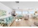 Bright living room with water views, hardwood floors and coastal inspired decor at 9696 Little Gasparilla Isand, Placida, FL 33946