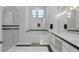 Bright bathroom with a glass-enclosed shower, jacuzzi tub, and a double sink vanity at 14472 Linden Dr, Spring Hill, FL 34609