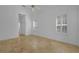 Bedroom with vaulted ceiling, travertine tile floors, and plantation shutters at 14472 Linden Dr, Spring Hill, FL 34609