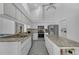 Bright kitchen with white cabinetry, stainless steel appliances, and a central island at 14472 Linden Dr, Spring Hill, FL 34609