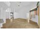 Open-plan living room featuring neutral decor and travertine tile floors at 14472 Linden Dr, Spring Hill, FL 34609
