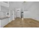 Open-concept living area with tile flooring, high ceilings, and views of the front entrance at 14472 Linden Dr, Spring Hill, FL 34609