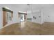 Spacious living room featuring travertine tile floors and access to the pool at 14472 Linden Dr, Spring Hill, FL 34609