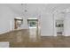 Expansive living area with tile floors, ceiling fans, and sliding glass doors leading to the pool at 14472 Linden Dr, Spring Hill, FL 34609