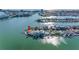 Stunning waterfront home with private dock, lush landscaping, and panoramic water views at 11005 5Th E St, Treasure Island, FL 33706