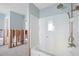 Bathroom featuring a shower with a glass door and unique tile flooring, ready for upgrades and customization at 11005 5Th E St, Treasure Island, FL 33706