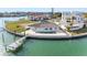 Charming waterfront home with private dock and pool surrounded by manicured landscaping at 11005 5Th E St, Treasure Island, FL 33706