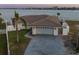 Beautiful single-story home featuring a two-car garage, well-maintained lawn, and fenced yard at 11005 5Th E St, Treasure Island, FL 33706