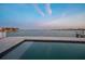 Waterfront home with a beautiful pool and open water views, creating a tranquil and scenic retreat at 11005 5Th E St, Treasure Island, FL 33706