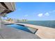 Inground pool with expansive waterfront views overlooking the intercoastal, on a beautiful sunny day at 11005 5Th E St, Treasure Island, FL 33706
