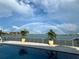 Outdoor pool with beautiful waterfront view, creating a serene and relaxing outdoor space to unwind and enjoy at 11005 5Th E St, Treasure Island, FL 33706