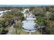 Unique home architecture featuring a flat roof, complemented by lush, mature landscaping and surrounding neighborhood at 1111 Dr M L King Jr N St, Safety Harbor, FL 34695