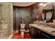 Modern primary bathroom with glass enclosed shower and double sink vanity with decorative mirror at 1111 Dr M L King Jr N St, Safety Harbor, FL 34695