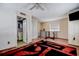 Bedroom with wood floors, red and black rug, and an adjacent bathroom at 1111 Dr M L King Jr N St, Safety Harbor, FL 34695