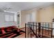 Upstairs bedroom featuring a ceiling fan, wood floors, and access to a shower at 1111 Dr M L King Jr N St, Safety Harbor, FL 34695
