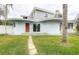 Modern home with a unique design, featuring a flat roof, and an outdoor patio at 1111 Dr M L King Jr N St, Safety Harbor, FL 34695
