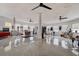 Bright and spacious circular living area with high ceilings, polished terrazzo floors, and unique architectural details at 1111 Dr M L King Jr N St, Safety Harbor, FL 34695