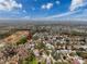 Panoramic aerial view of the neighborhood featuring lush landscaping and a pond at 11811 Derbyshire Dr, Tampa, FL 33626