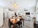 Dining room with an open concept to the kitchen and living room features wood flooring at 11811 Derbyshire Dr, Tampa, FL 33626