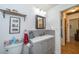 Bathroom featuring a gray vanity with a white countertop, framed mirror, and adjacent doorway at 12111 Scott Dr, Dade City, FL 33525