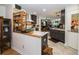 Stylish kitchen featuring modern cabinets, stainless steel appliances, and granite countertops at 12111 Scott Dr, Dade City, FL 33525