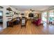 Cozy living room with laminate flooring, neutral decor and a ceiling fan at 12111 Scott Dr, Dade City, FL 33525