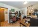 Cozy home office with a desk, office chair, and wood flooring at 12111 Scott Dr, Dade City, FL 33525