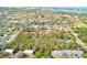 Aerial view of the wooded lot showcasing the property's lush landscape and privacy at 13450 Wilcox Rd, Largo, FL 33774