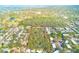 A bird's eye view of the property's layout, showing its generous land surrounded by residential homes at 13450 Wilcox Rd, Largo, FL 33774