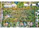 Aerial view of a potential development site outlined in red near existing homes, ponds, and roads at 13450 Wilcox Rd, Largo, FL 33774