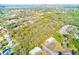 Beautiful aerial view of the expansive property and surrounding landscape with mature trees at 13450 Wilcox Rd, Largo, FL 33774