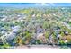 Aerial view of a plot for potential development, outlined in red, located near existing homes and roads at 13450 Wilcox Rd, Largo, FL 33774