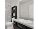 Bathroom features a combination tub and shower and a storage unit at 13946 Snapper Fin Ln, Tampa, FL 33637