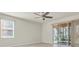 Bright bedroom with tile floors and large sliding glass doors to lanai at 13946 Snapper Fin Ln, Tampa, FL 33637