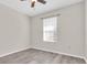 Bright bedroom with a ceiling fan and modern, neutral paint at 13946 Snapper Fin Ln, Tampa, FL 33637