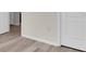 Hallway featuring neutral paint and modern luxury vinyl plank flooring at 13946 Snapper Fin Ln, Tampa, FL 33637