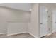 Hallway with laminate floors, white doors, and white baseboards at 13946 Snapper Fin Ln, Tampa, FL 33637
