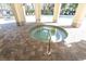 Inviting hot tub surrounded by decorative brickwork, offering a relaxing experience by the community pool at 13946 Snapper Fin Ln, Tampa, FL 33637