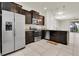 Modern kitchen with stainless steel appliances and dark wood cabinets at 13946 Snapper Fin Ln, Tampa, FL 33637