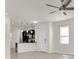 Open-concept living area with a ceiling fan and kitchen bar at 13946 Snapper Fin Ln, Tampa, FL 33637