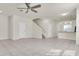 Bright open-concept living space with tile floors and modern lighting at 13946 Snapper Fin Ln, Tampa, FL 33637