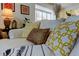 Close-up of sofa with decorative pillows and throws, showcasing the cozy and stylish design of the space at 1718 Golfview Dr # 1718, Tarpon Springs, FL 34689