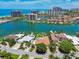 Stunning aerial view of waterfront homes, showcasing the idyllic coastal living and serene water views at 205 Harrison Ave, Belleair Beach, FL 33786
