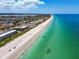 Scenic aerial view of a beach with pristine sand and clear turquoise water at 205 Harrison Ave, Belleair Beach, FL 33786