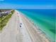 Picturesque aerial view of a beach with pristine sands and clear turquoise water at 205 Harrison Ave, Belleair Beach, FL 33786